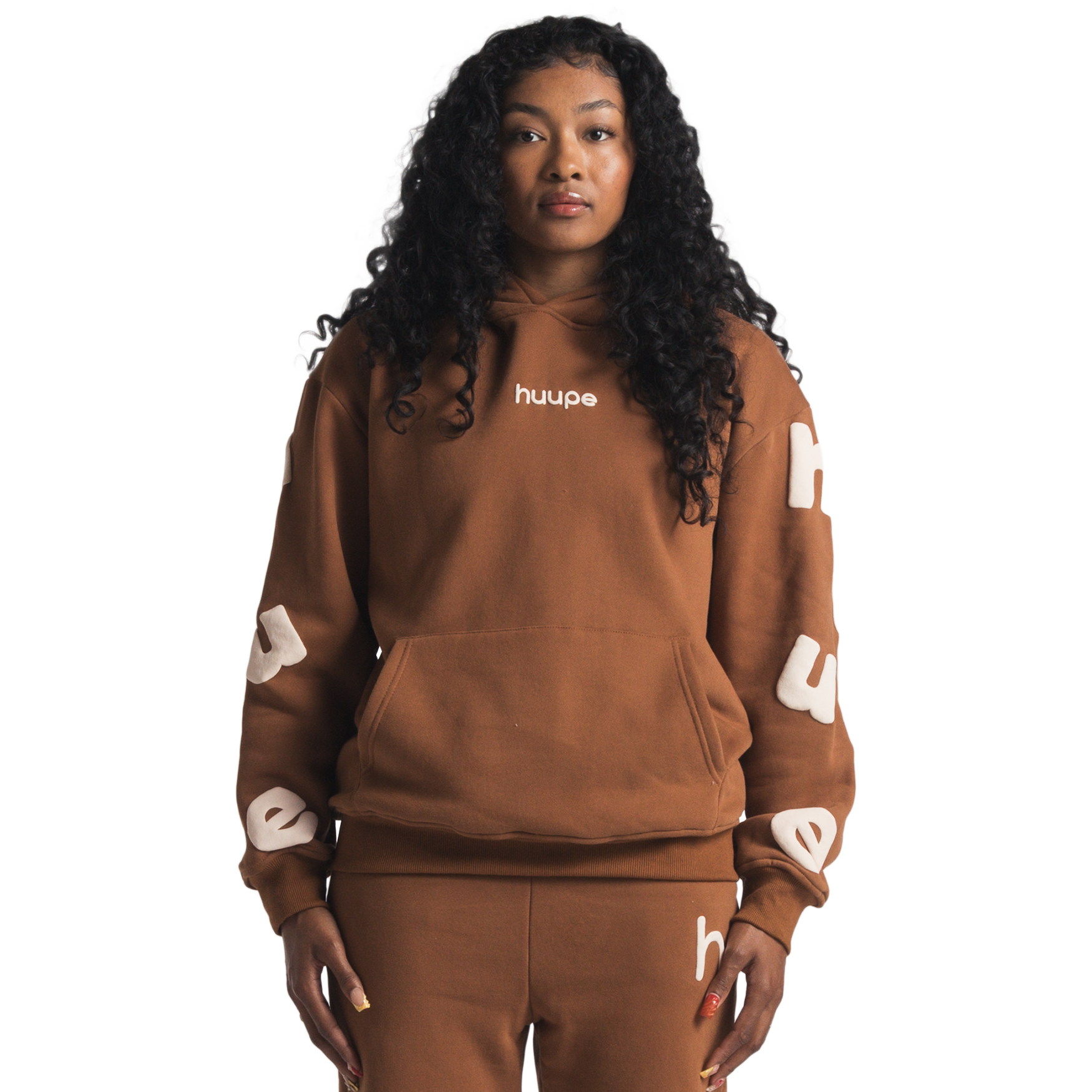 woman wearing brown huupe sweats